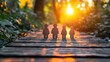 © Tai - Silhouettes of four paper cut-out children standing on a wooden pathway in a lush green forest during sunset, creating a warm and peaceful atmosphere