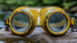 © Nabila Ayu - Vintage yellow goggles near water