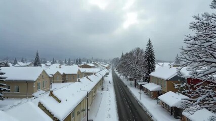 Wall Mural - snowy street with houses and trees on both sides of it
