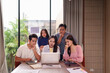 © Pichsakul - Asian business professionals adults collaborate solve complex problem discuss strategy review data modern office environment during important team meeting