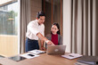 © Pichsakul - Asian male female adult colleagues working together on laptop business project planning strategy financial growth meeting office teamwork digital solutions