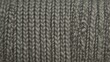 © Laongdouw - Close-up of textured gray knitted fabric, perfect for showcasing craftsmanship and textile design in hobby projects.