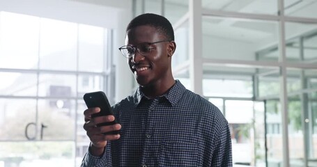 smile, phone and communication with black man in office for networking, social media and online busi