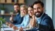 © Valentina - Group of happy businesspeople laughing cheerfully in an office
