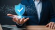 © Nouman - Businessman holding shield with checkmark, symbolizing cybersecurity, data protection, network safety, and privacy for information technology systems