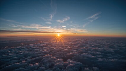 Wall Mural - Dawn breaking over a clear azure sky with scattered clouds