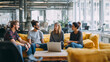 © Kristina - A group of young professionals collaborating in a bright coworking space