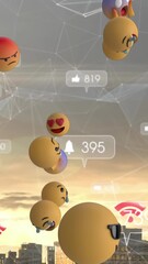 Wall Mural - animation of emojis and social media digital icons floating over cityscape
