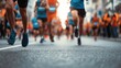 © Selvi - A group of runners participating in a marathon race, with their legs and feet captured in motion on an asphalt road.