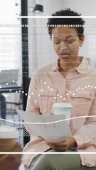 Wall Mural - animation of data processing over african american businesswoman in office