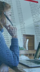 Wall Mural - animation of data processing over caucasian woman having a video call on laptop
