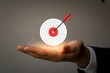 © Hnaistock - Achieving Goals and Targets Hand Holding a Target with Arrow Hitting the Bullseye Symbolizing Success Accuracy and Strategic Planning in Business and Life
