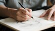 © 遁去 的一 - Artist sketching a face with a pencil on a notebook