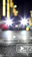 Wall Mural - animation of social media icons on multiple speech bubbles over blurred view of night city street