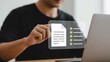 © Graphics_Bazaar - Modern professional managing digital documents and tasks with ease, ensuring compliance and efficiency through technology, seamlessly integrating work and innovative solutions