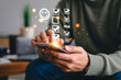 © ABIR - Person using a smartphone for online survey and checklist satisfaction application with glowing digital user interface elements reflecting customer feedback