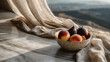 © Matthias - Ripe peaches and fresh figs fill a bowl, sitting on a marble surface draped with linen cloth. The background suggests a sunny summer day in the rolling hills of Italy