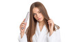 © CStock - Woman in bathrobe styling her hair with a straightener, isolated on white background.