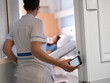 © Victor - Healthcare professional utilizing smartphone technology for digital workflow management in clinical setting