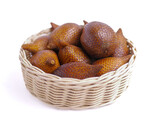 Fresh snakefruit on a wicker bowl isolated on white background, buah salak, salacca zalacca, deliciousy