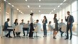 © zain - Blurred office scene with diverse professionals in a bright and modern workspace environment setting