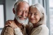 © Iftikhar alam - Happy senior couple sharing a warm embrace at home, showcasing love and togetherness in a cozy living space during a bright afternoon