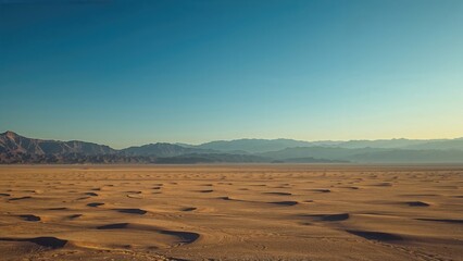 a broad, calm desert setting displaying tiered mountain profiles receding into the far background un