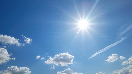 Wall Mural - Bright Blue Sky with Fluffy White Clouds and Sunshine
