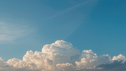 Wall Mural - Tranquil afternoon scene featuring soft sunlight and puffy clouds against a bright blue backdrop