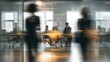 © saharuddin - Blurred office interior, people moving through glass partitions