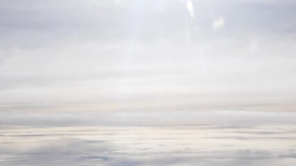 Wall Mural - blue sky with white fluffy clouds from airplane flight fly over the clouds in a sunny day with cloud moving in summer time cloudscape background