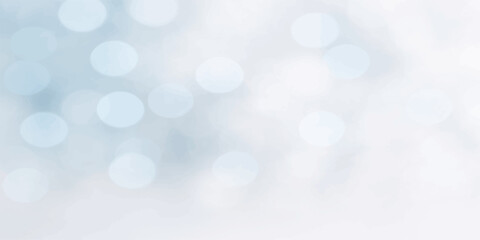 Abstract blue bokeh background with bright glowing lights and soft winter holiday sparkle pattern