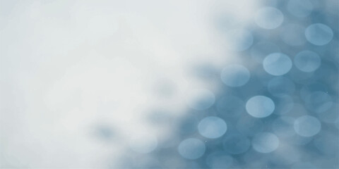 Blue abstract bokeh background with bright glowing light and winter holiday decoration pattern