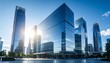 © MdRakibul - Glass buildings business concept. The glass facade of a skyscraper with a mirror
