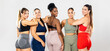 ©  Yistocking - A group of young, multiethnic women in their 20s and 30s posing against a white background in athletic clothing. The five women with different body types, are standing in colorful athletic wear.