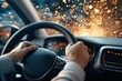 © vilaiporn - Close-up of hands gripping a steering wheel inside a moving car, capturing a dynamic driving experience.