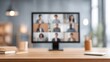 © Blur Bokeh - blurred image of a group virtual meeting with students projecting on screen, tidy desk beneath.