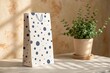 © Rimel - Tall gift bag with a cute animal pattern and a potted plant