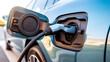 © StockClarity - Close-up of an electric car charging port with a charging cable inserted image photo