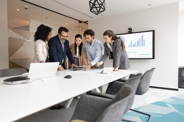 project planning. professional multiethnic business team ahead with mature man leader stand around t