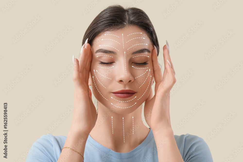Beautiful young woman doing face building exercise on beige background ...