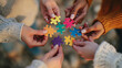 © Farukhassan - Diverse hands connect colorful puzzle pieces symbolizing unity and teamwork