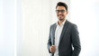 © True Stock - Confident young startup professional posing in modern minimalist office