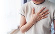 © Ton Photographer4289 - Woman puts hand on chest because of pain caused by acid reflux, frequent burping. Healthcare and medicine concept.