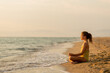 © BGStock72 - Meditative moments by the serene shoreline at sunset