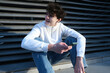© Yevhen - Boy male use mobile phone smartphone. online web internet search or sms text messages texting and speaking