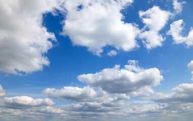 a beautiful blue sky with soft, white clouds, for an abstract background