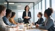 © Qi - Businesswoman leading a meeting with colleagues in a modern office setting