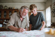 © SolaruS - Intimate portrait of a grandfather and grandson looking at something together on a table. It evokes feelings of heritage, bonding, and connection between generations.