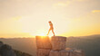 © wkproduction - Runner leaps between rocky peaks at sunrise, symbolizing endurance and achievement. Golden light highlights determination and joy in the great outdoors.